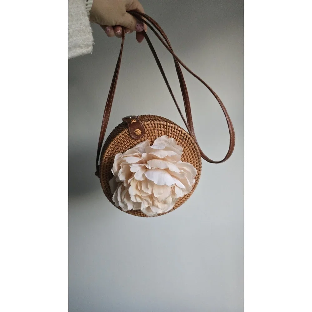 Handwoven round rattan Bali crossbody bag with straps & decorated with‎ flowers
